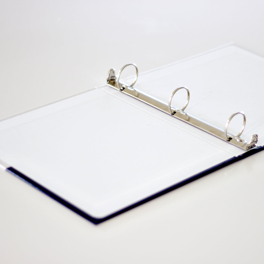 Our 3-ring binders are made of solid chipboard and have a blank white interior