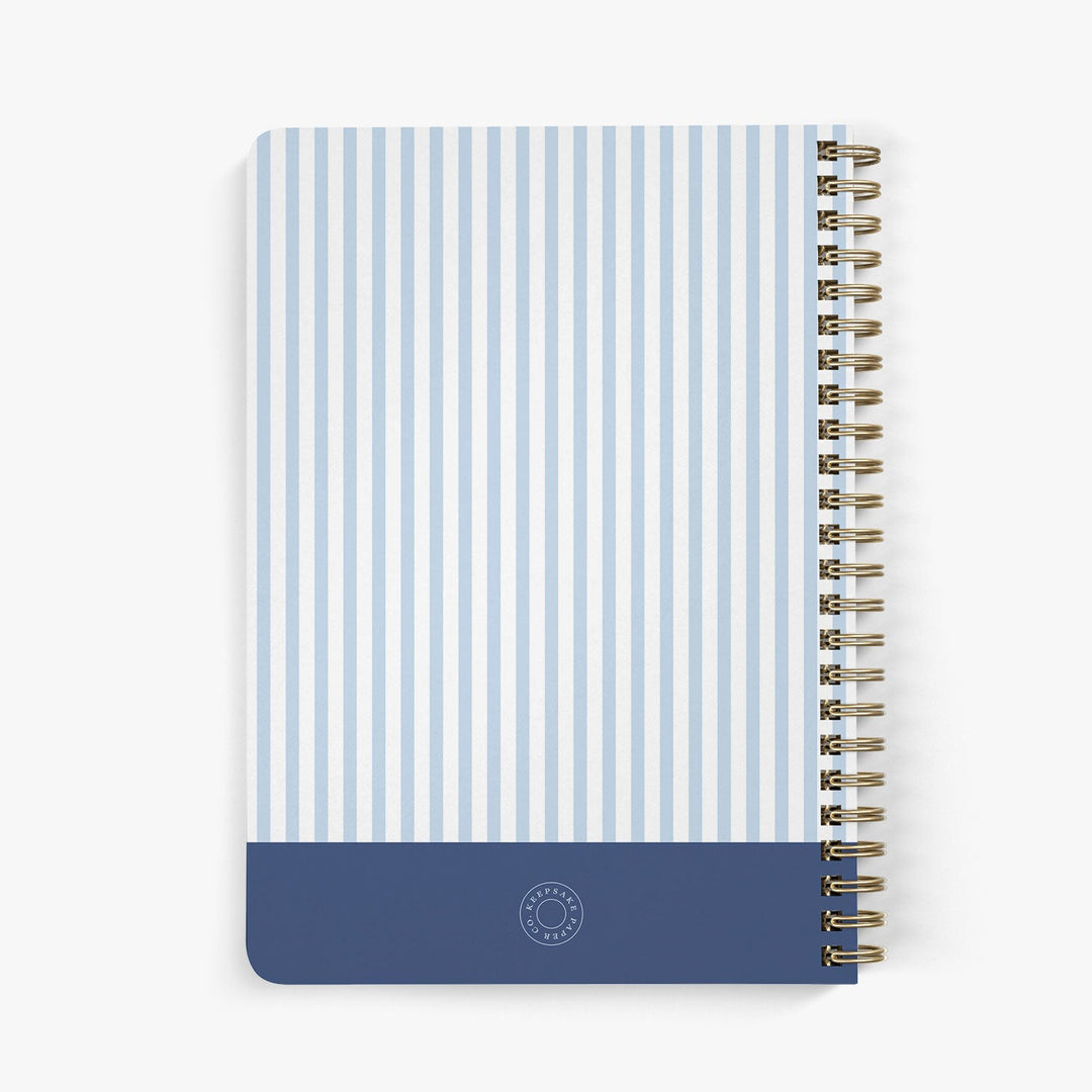 Back view of personalized address book with blue and white striped design on a white background