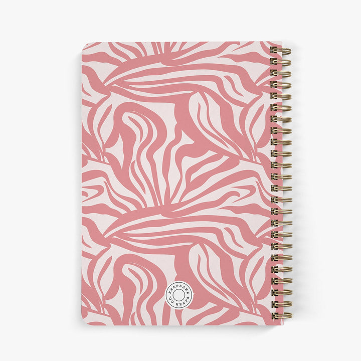 Back view of personalized password notebook with a swirling pink abstract pattern on a white background