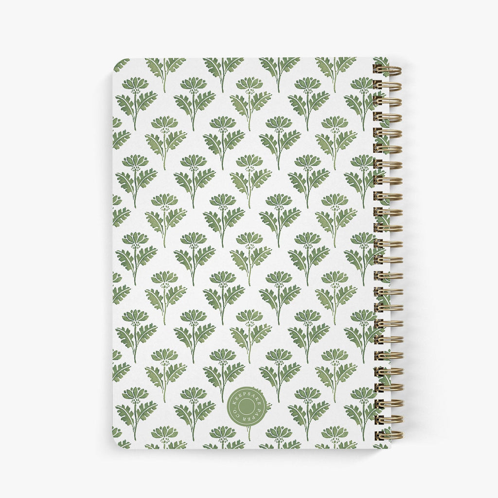 Back view of personalized password notebook in a green and white floral ink block pattern on a white background