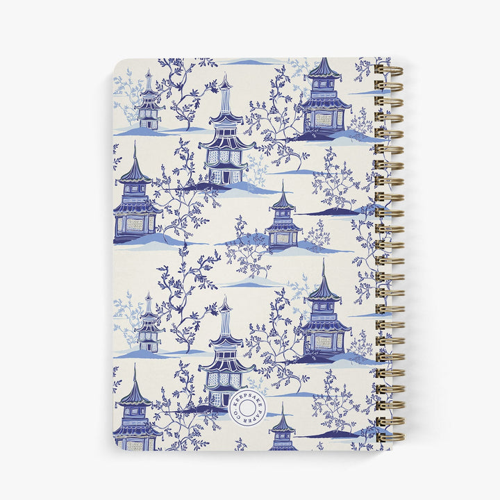 Back view of a chinoiserie inspired address book with a blue and white pagoda design