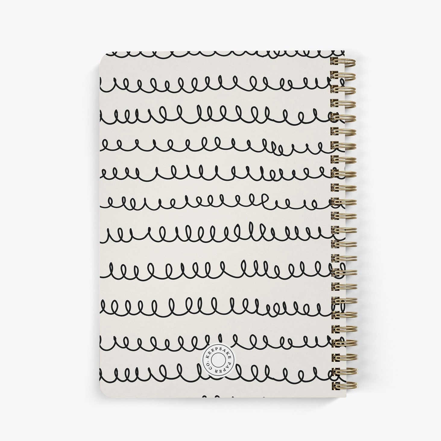 Back view of a personalized address notebook with whimsical squiggle design in black on a beige cover