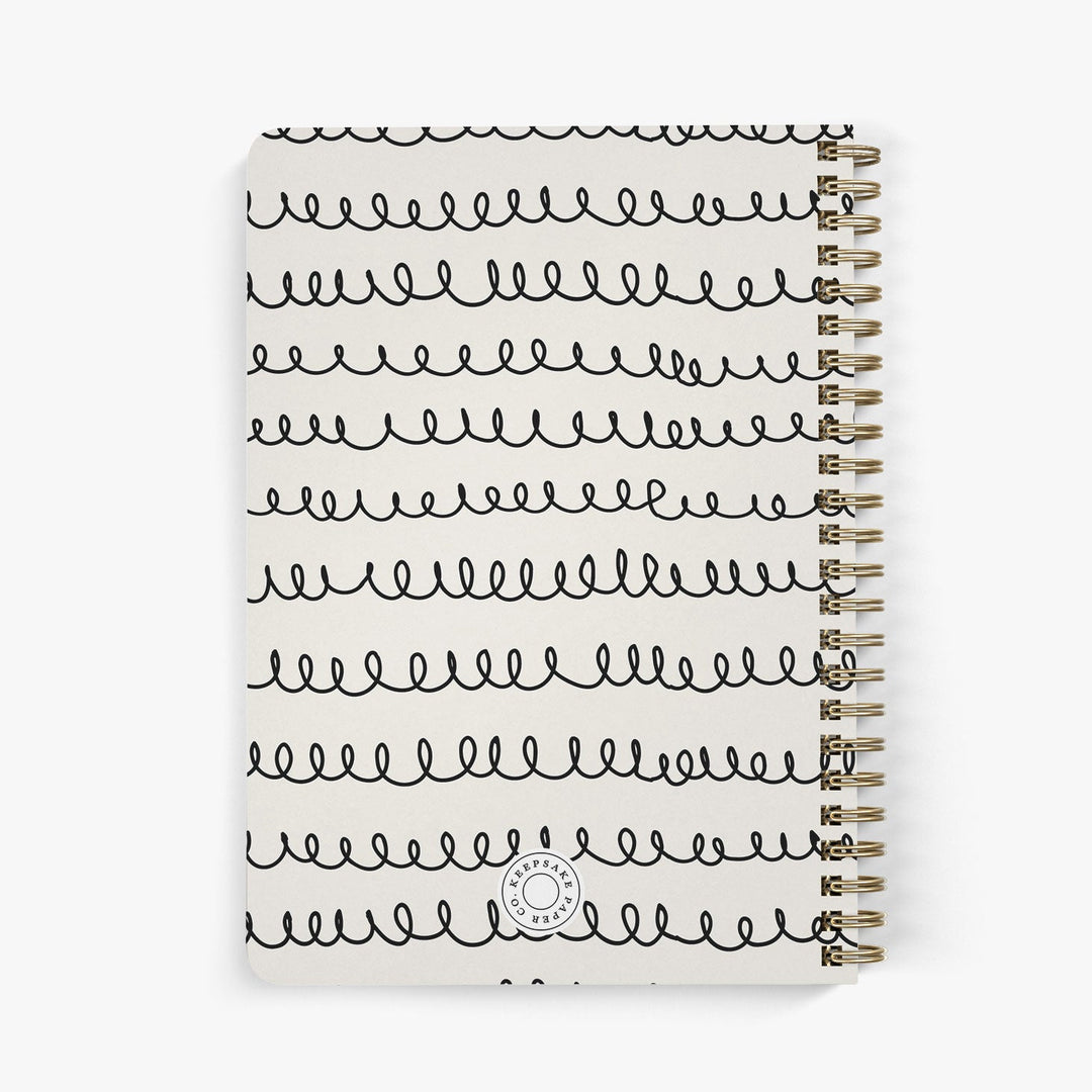 Back view of personalized password notebook with black and beige squiggle design on a white background