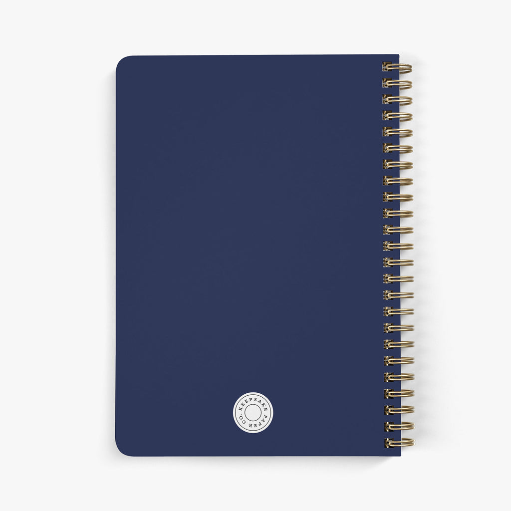Back view of a custom maid of honor planner with gold spiral binding on a white background