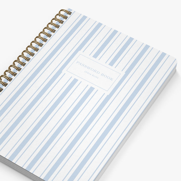 Password book with blue and white striped cover on a white background