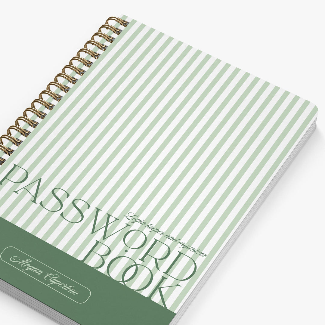 Password book with green and white striped cover on a white background