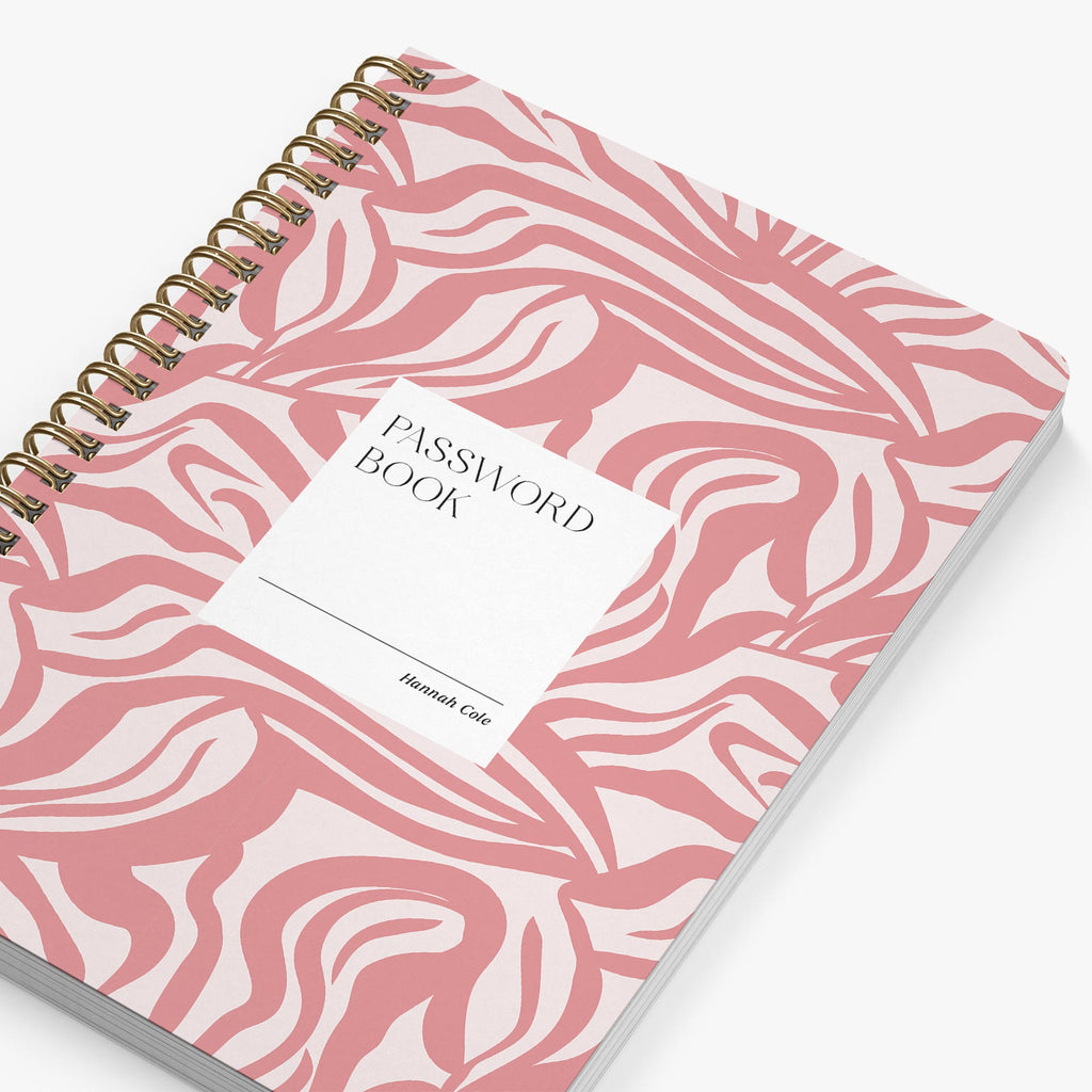 Password book with pink and white marbled cover on a white background