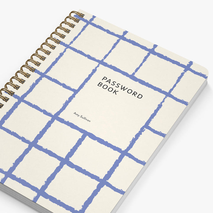 Password book with blue grid design on a white background