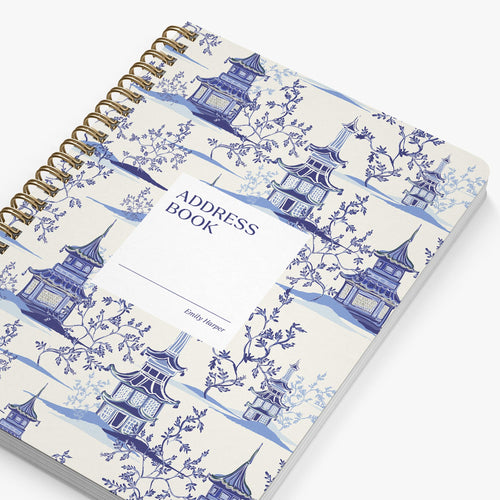 Address book with blue pagoda design on a white background
