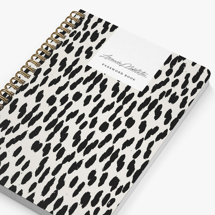 Password book with black leopard print pattern on white cover