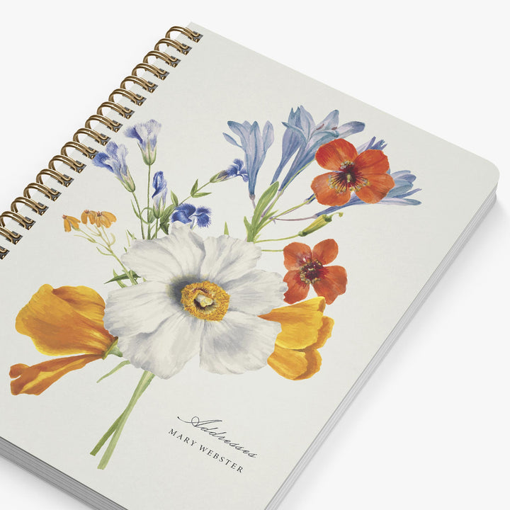 Notebook with floral design on a white background