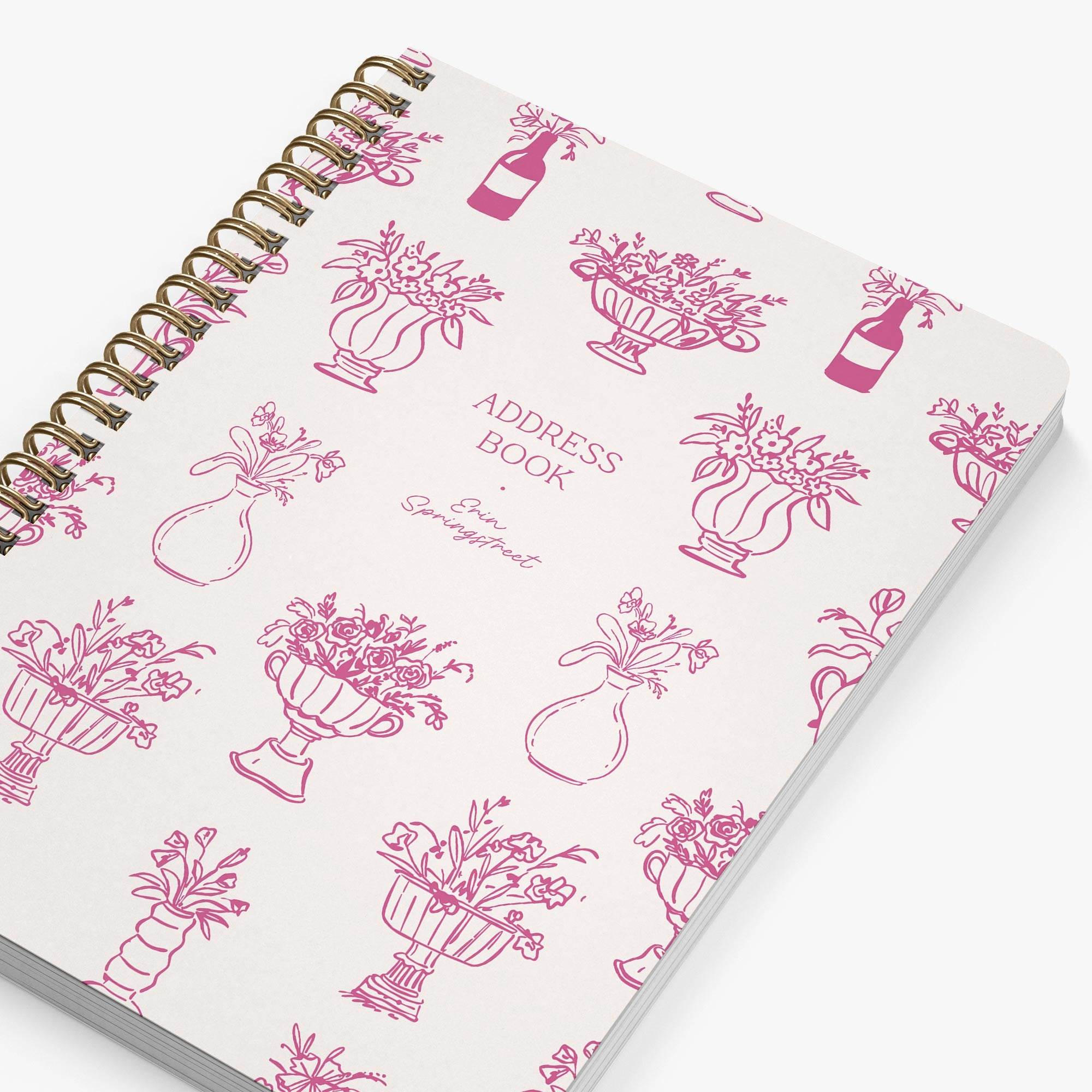 Address book with pink floral illustrations on a white background