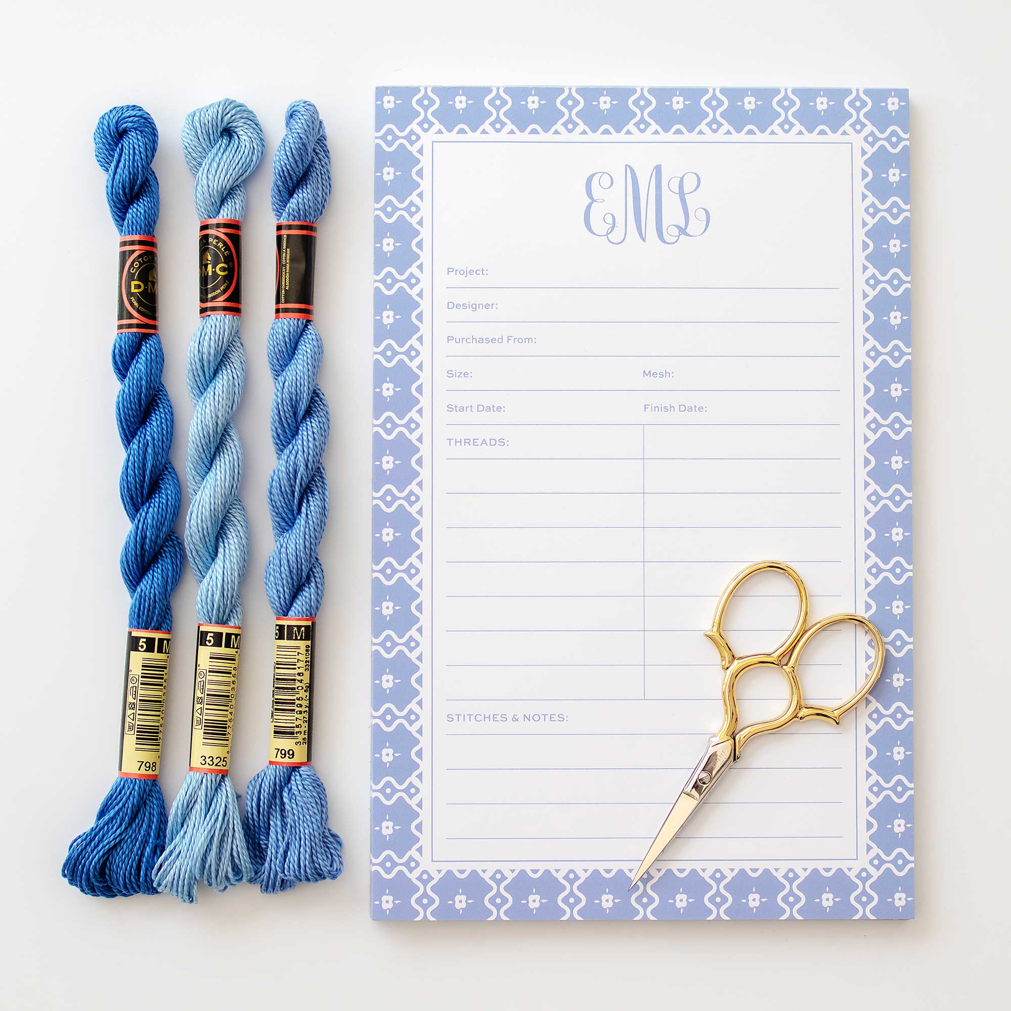 Custom needlepoint notepad with space for canvas name, designer, mesh count, threads and more styled with gold scissors and skeins of perle cotton