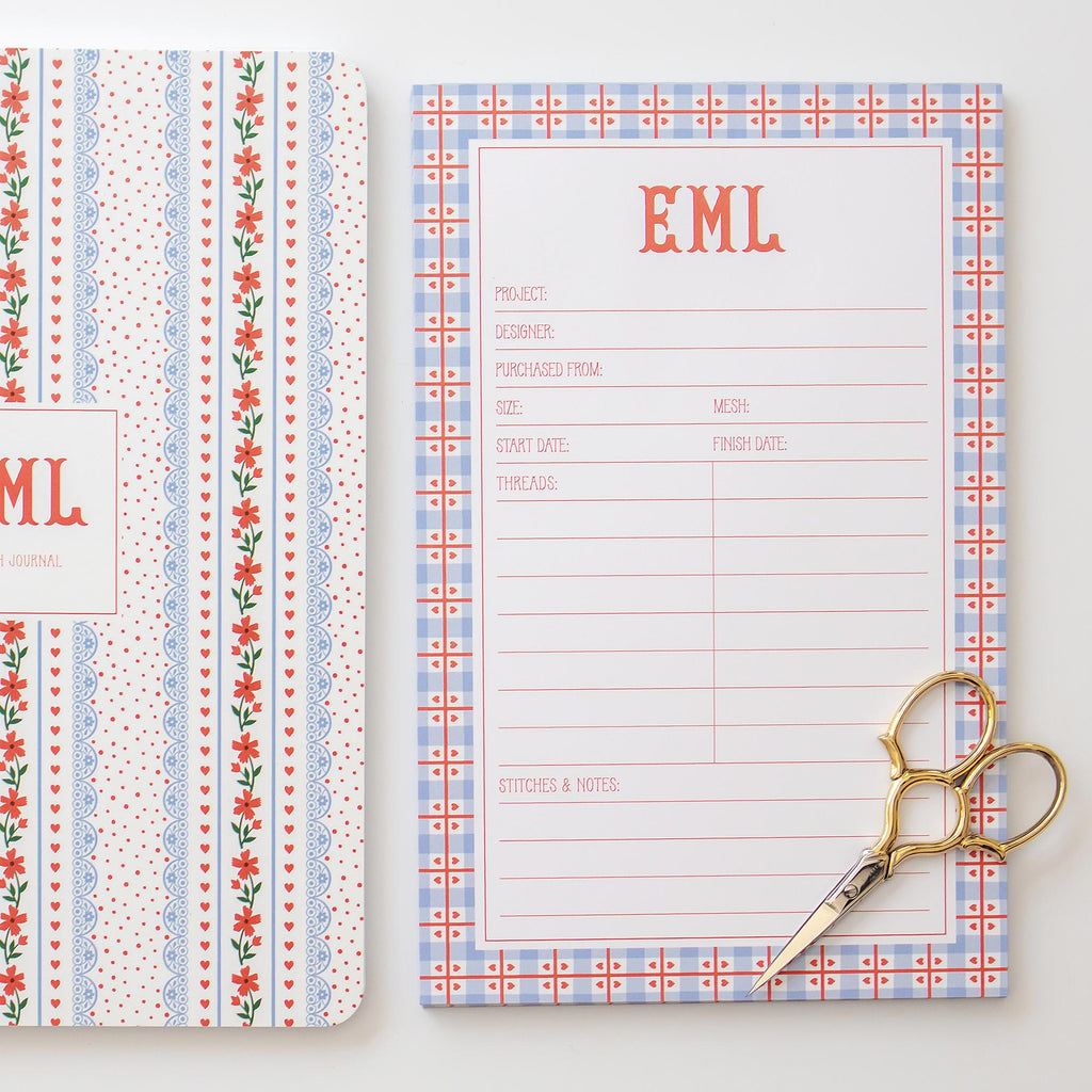 Needlepoint notepad styled with a needlepoint project tracker with floral and gingham design on a white background