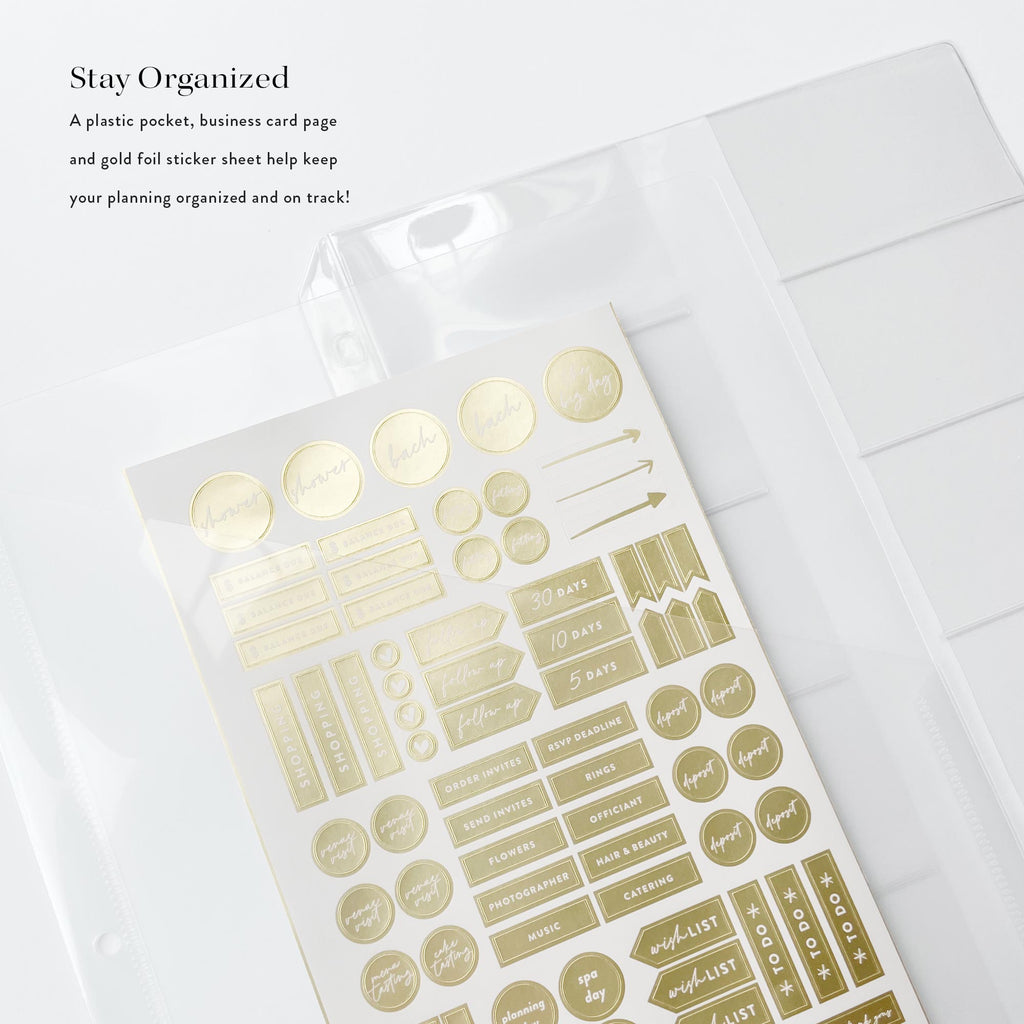 Gold foil stickers in a clear packaging on a white surface