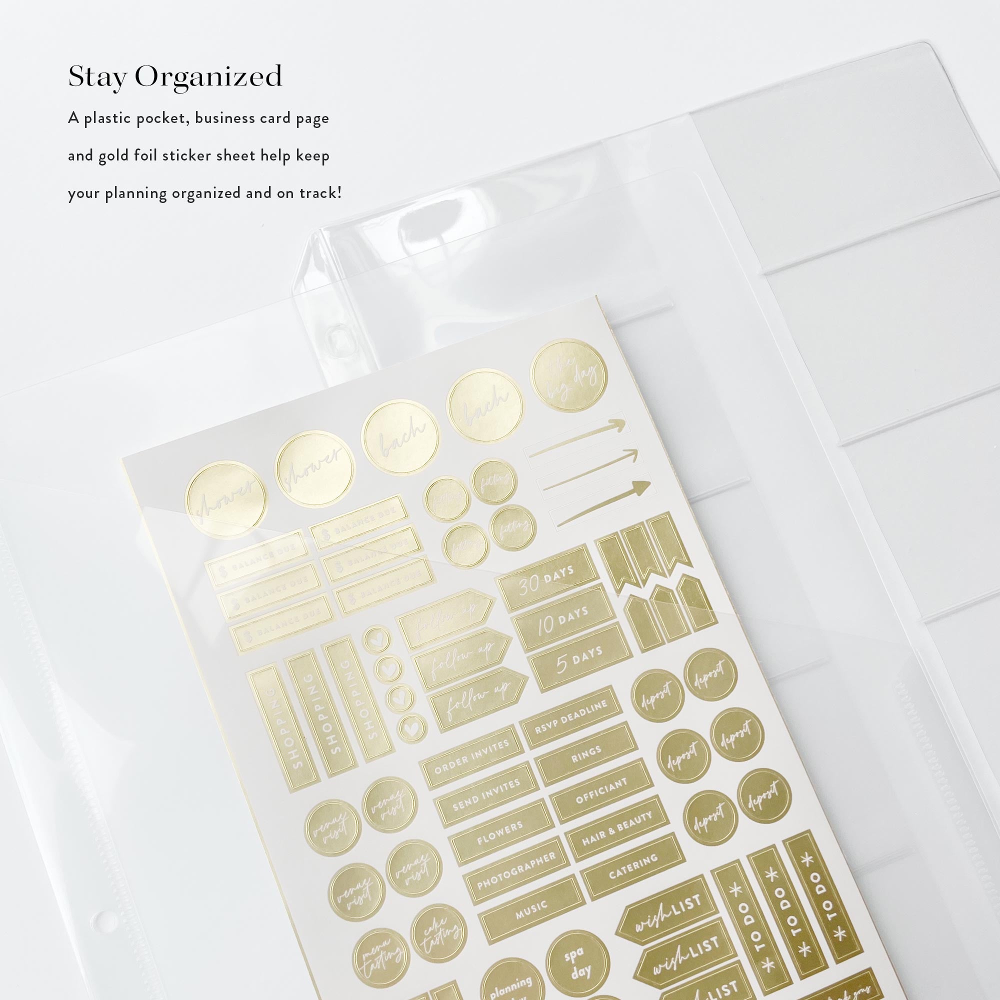 Gold foil stickers in a clear packaging on a white surface