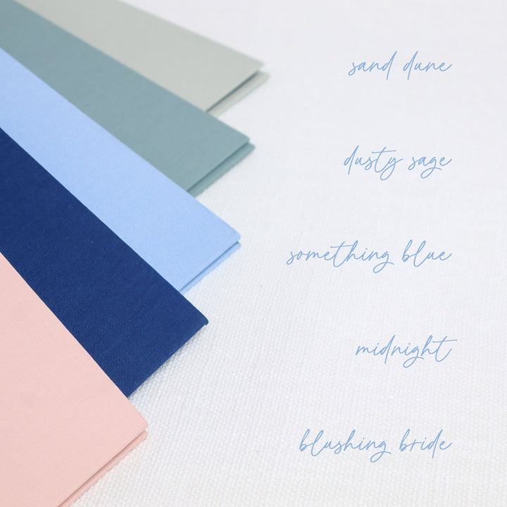 Our custom linen binders come in five different color options and each one includes our signature wedding planner and one inside pocket