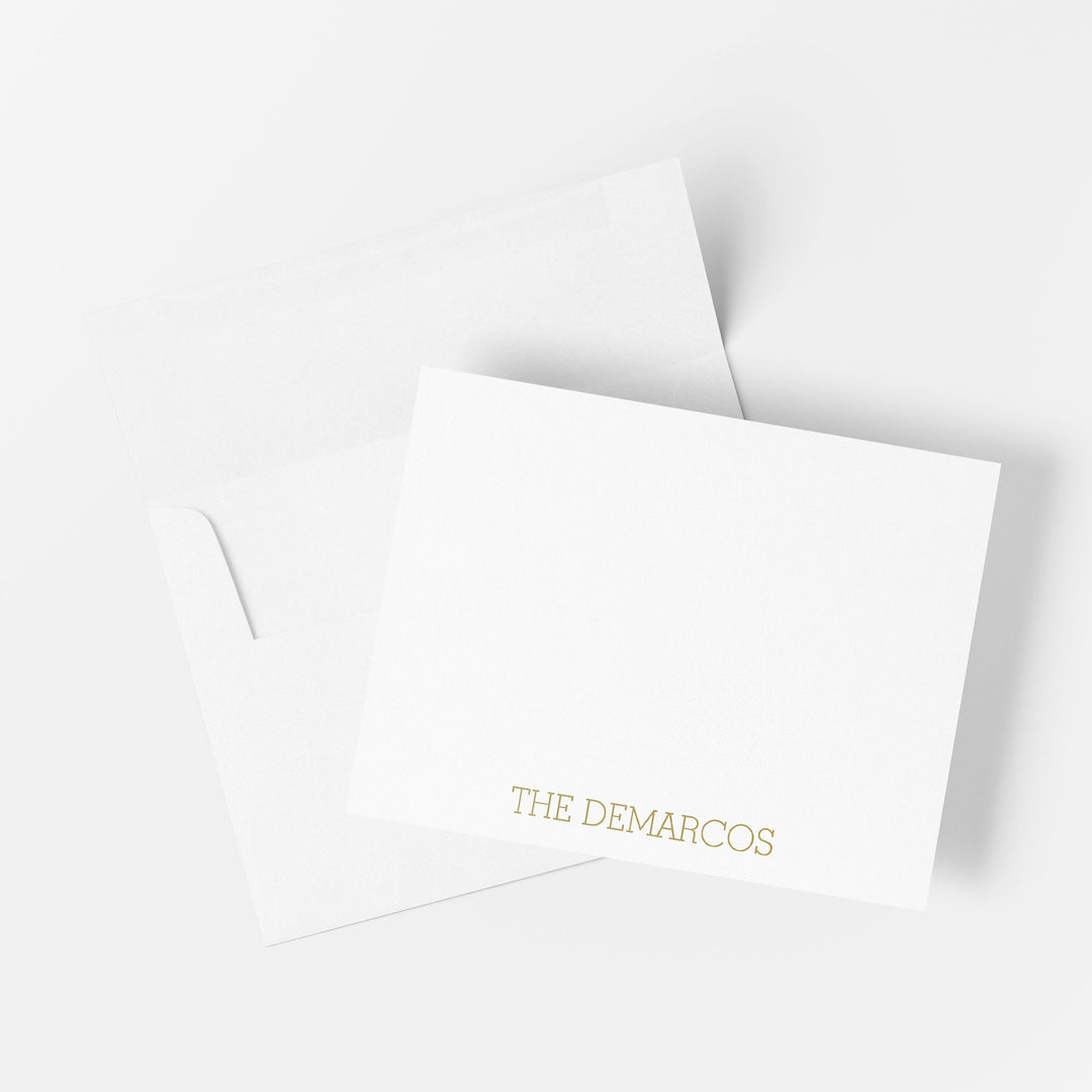 Personalized gold foil note card printed by hand on cotton paper with matching envelope on a white background