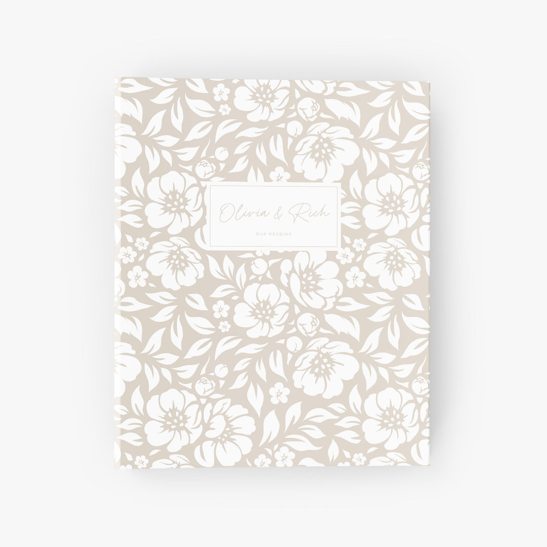 Personalized wedding planning binder featuring a white and beige floral design customized with the couple's names