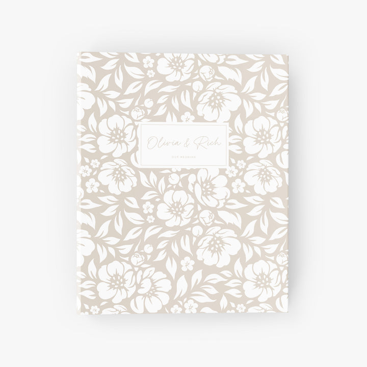 Personalized wedding planning binder featuring a white and beige floral design customized with the couple's names