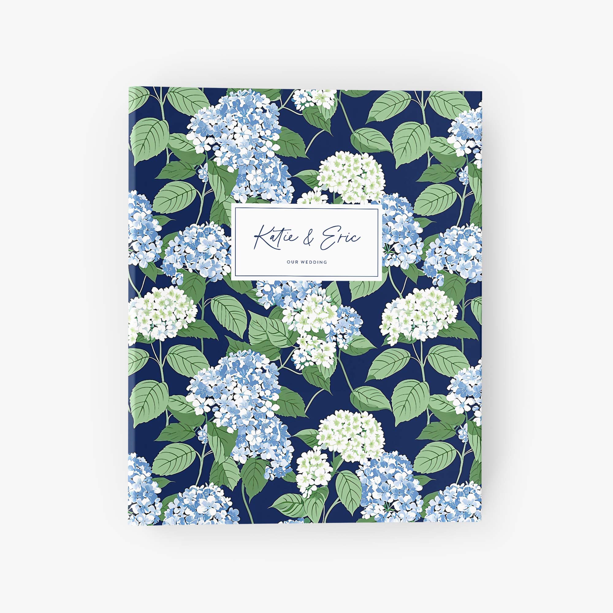 Custom wedding planning binder with blue and white hydrangea pattern personalized with the names of the bride and groom