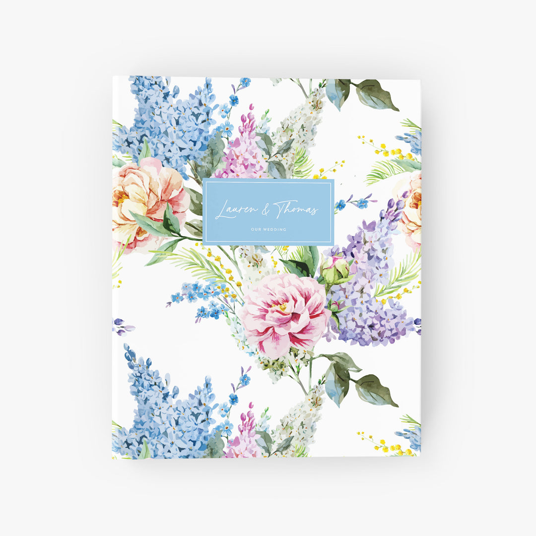 Custom wedding planning binder with bouquet of lilacs and roses personalized with the names of the bride and groom