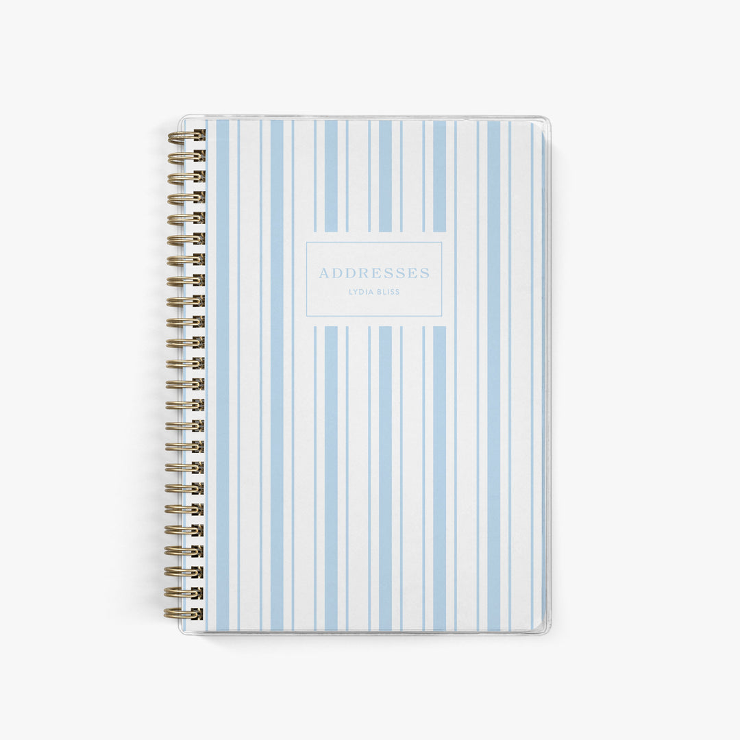 This simply striped blue & white address book can be customized with your name on the cover