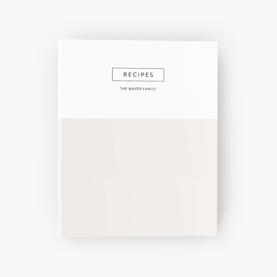 Custom recipe binder with a modern color block design shown in beige and white and personalized with a family name