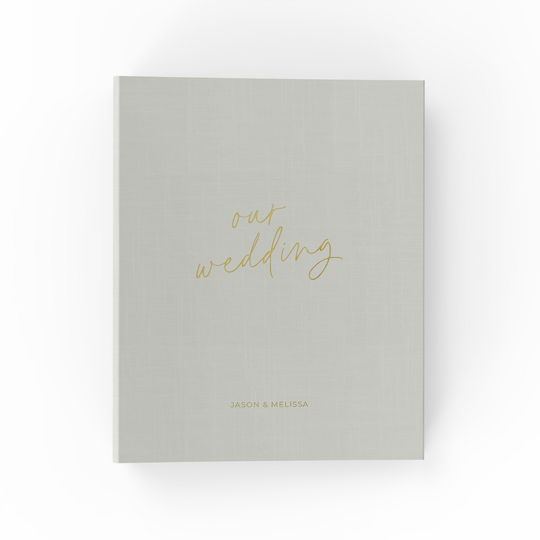 Our wedding binders are the perfect wedding planning tool, shown in a "our wedding" script design with the couple's first names