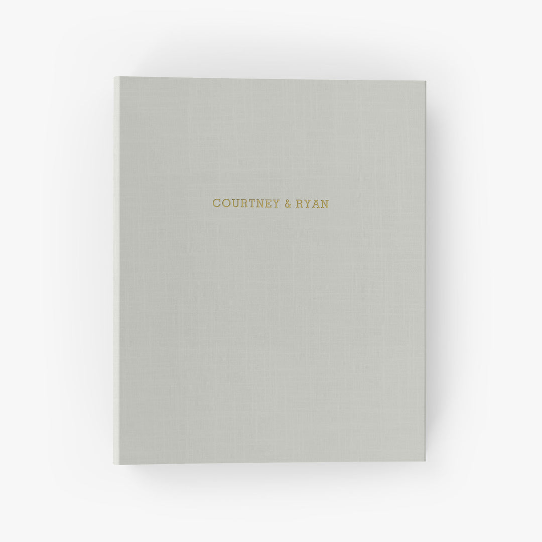 Our wedding binders are the perfect wedding planning tool, shown with the couple's first names on the cover