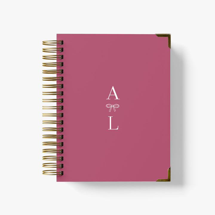 Our LGBT wedding planner books are all-inclusive and gender-neutral, shown in an darling bow with monogram design