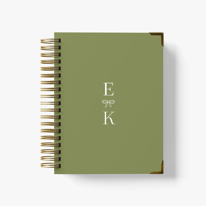 Our luxury wedding planner books are the best a bride can buy, featuring a classic monogram with ribbon bow