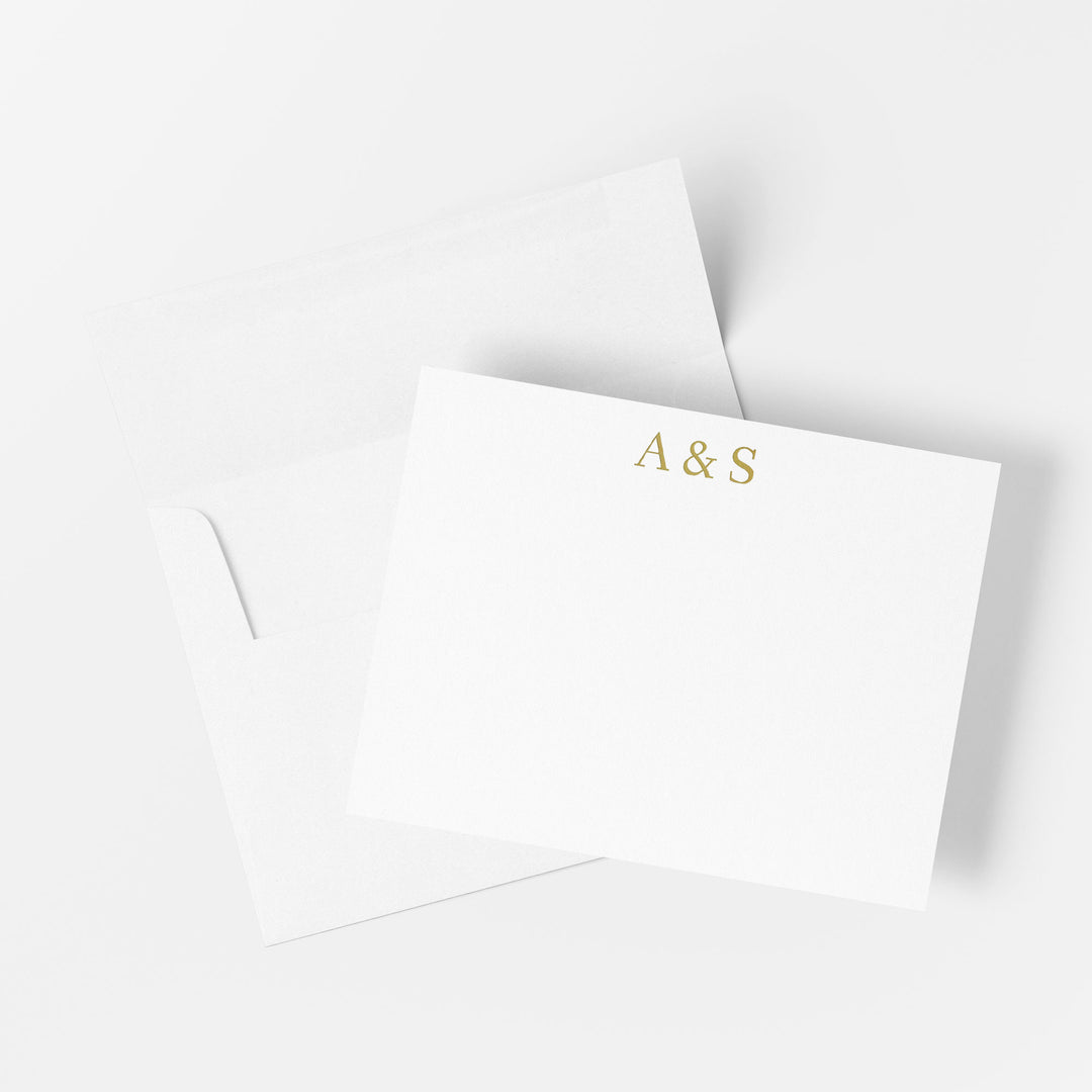 Personalized gold foil note card printed by hand on cotton paper with matching envelope on a white background
