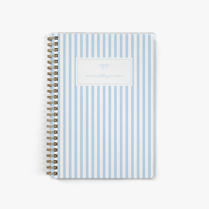 Light blue and white vertical stripe elopement planner with preppy bow detail, for classic wedding organization