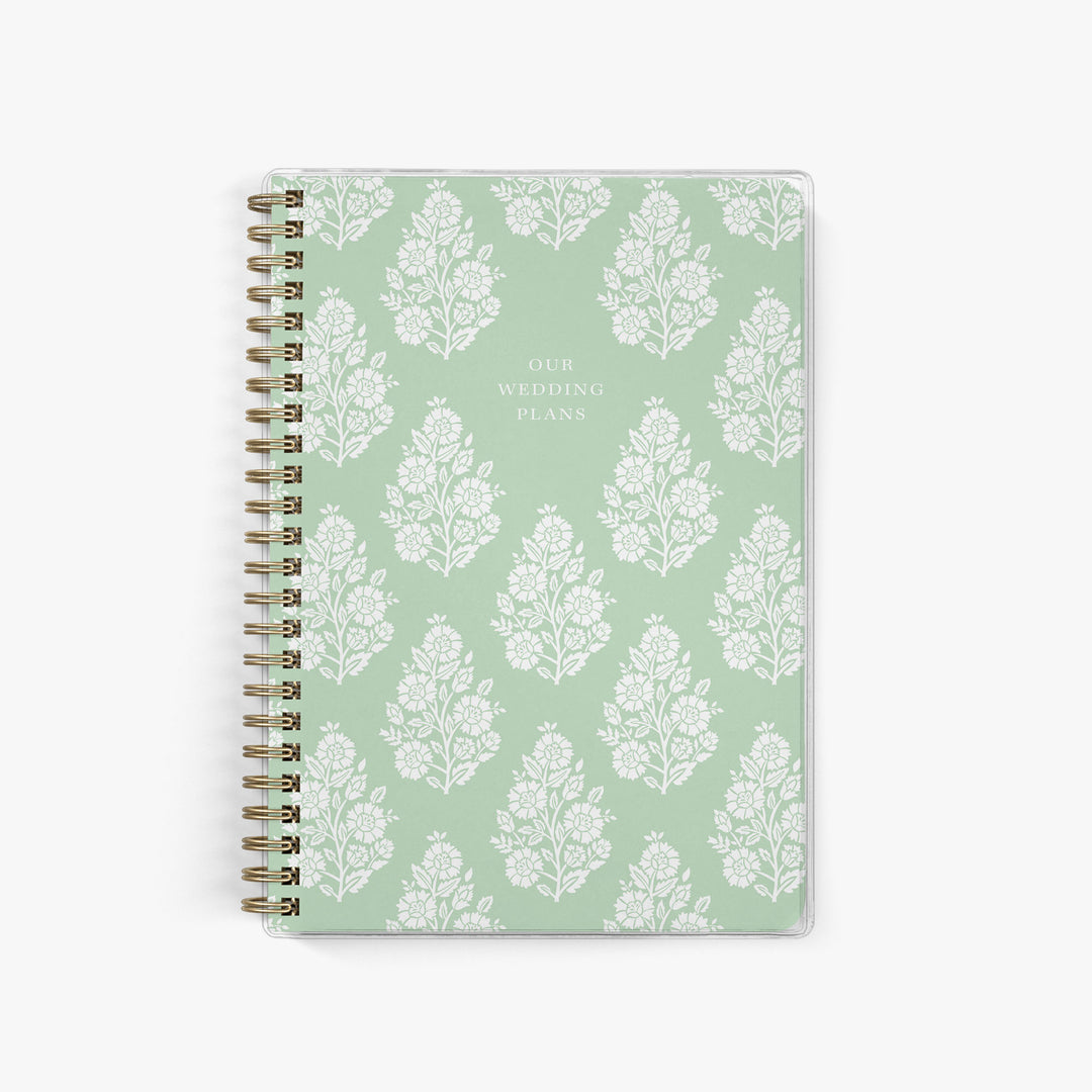 Soft sage green elopement planner with vintage-inspired block print floral cover for classic, botanical wedding planning