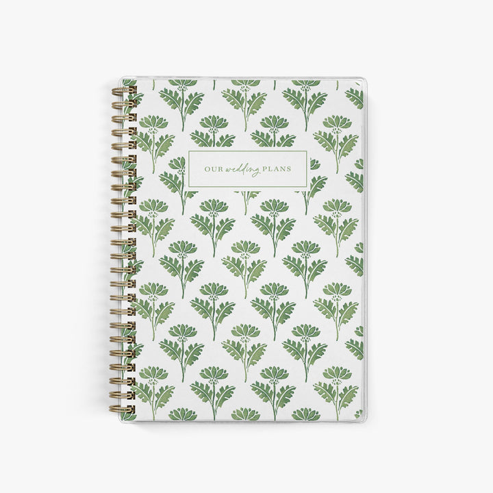 Soft sage green elopement planner with vintage-inspired green and white block print floral cover for classic, botanical wedding planning