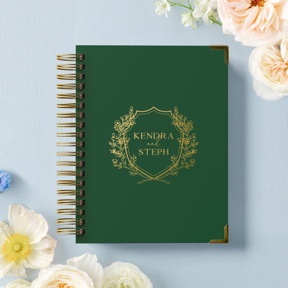 Our LGBT wedding planner books are all-inclusive and gender-neutral, shown in an elegant floral crest design