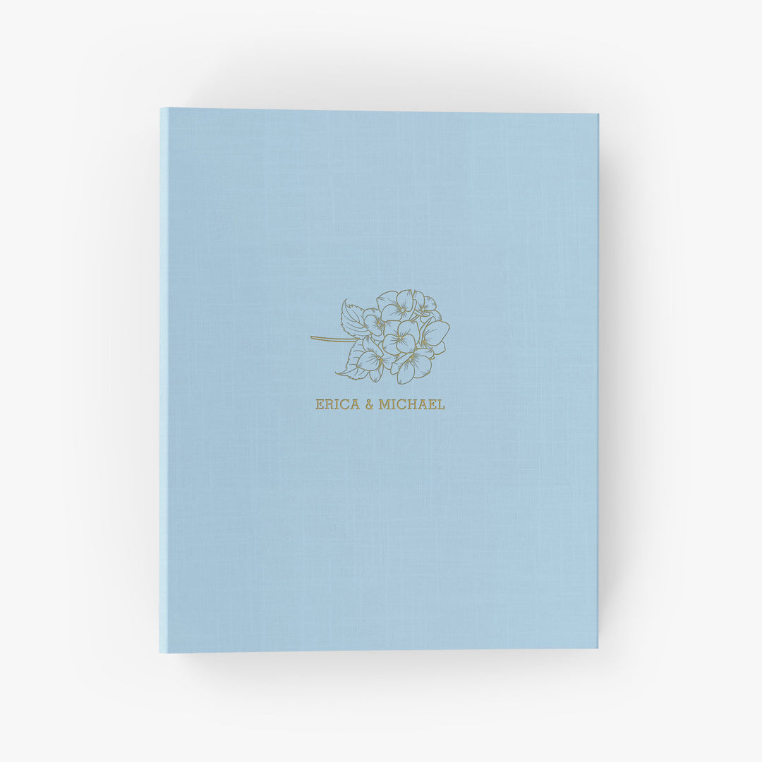 Our wedding binders are the perfect wedding planning tool, shown in a hydrangea design with the couple's first names
