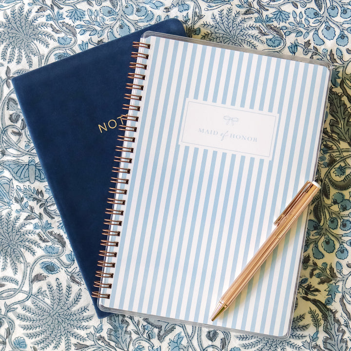 Our exclusive maid of honor planners are the perfect gift for your best friend, shown in a classic stripe design with bow