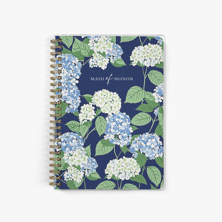 Our exclusive maid of honor planners are the perfect gift for your best friend, shown in a blue, white and green hydrangea pattern