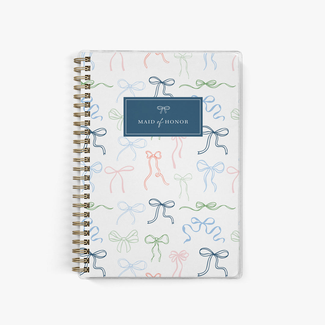 Our exclusive maid of honor planners are the perfect gift for your best friend, shown in a delicate bow design.
