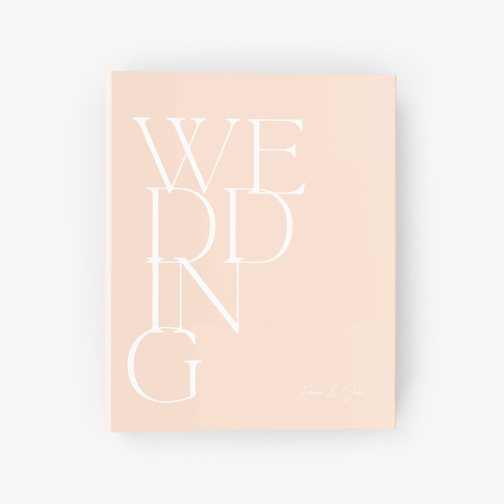 Custom wedding planning binder with bold text that reads 'WEDDING' on the cover with your names
