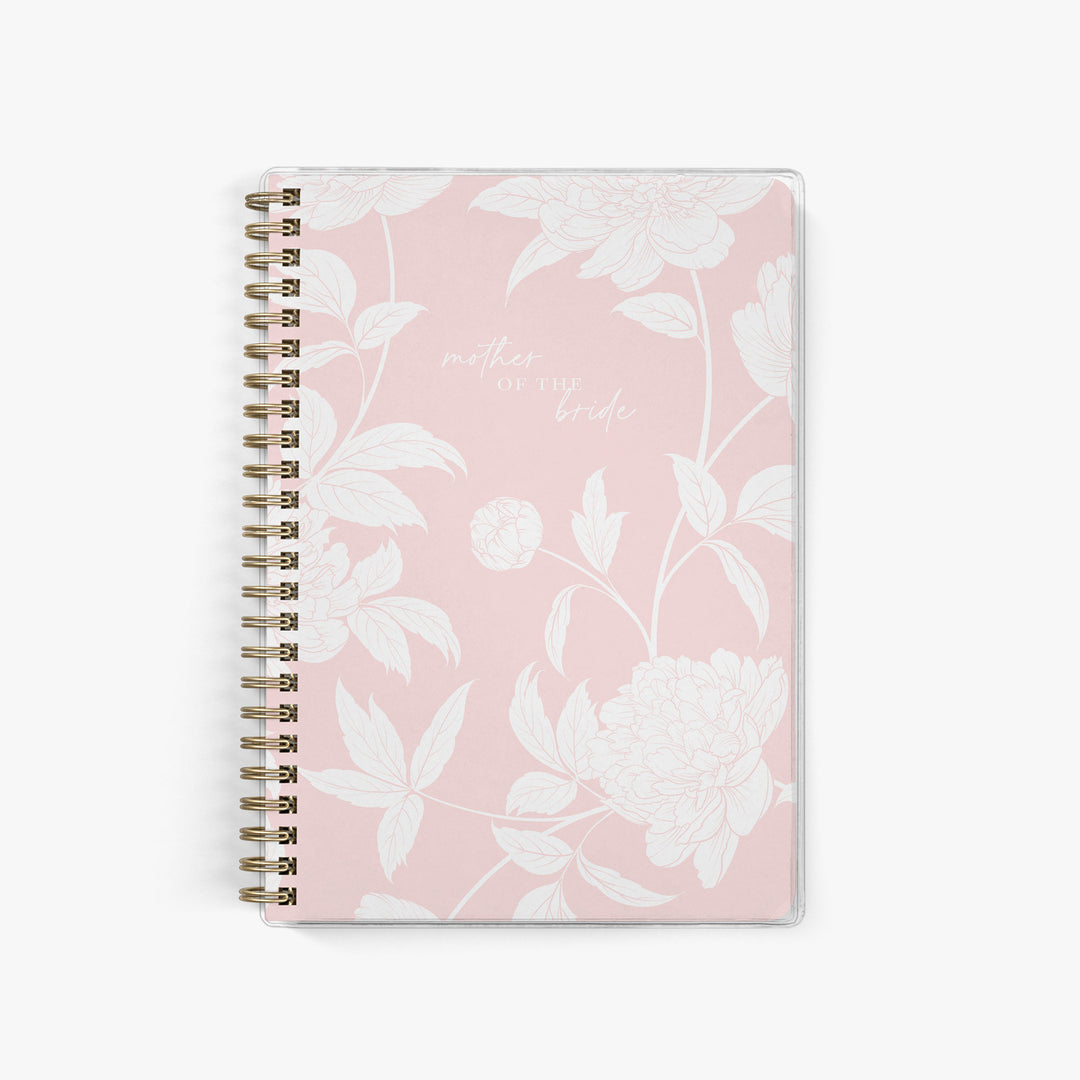 Shown in a blush peony print, Mother of the Bride planners are exclusive to Keepsake Paper Co.