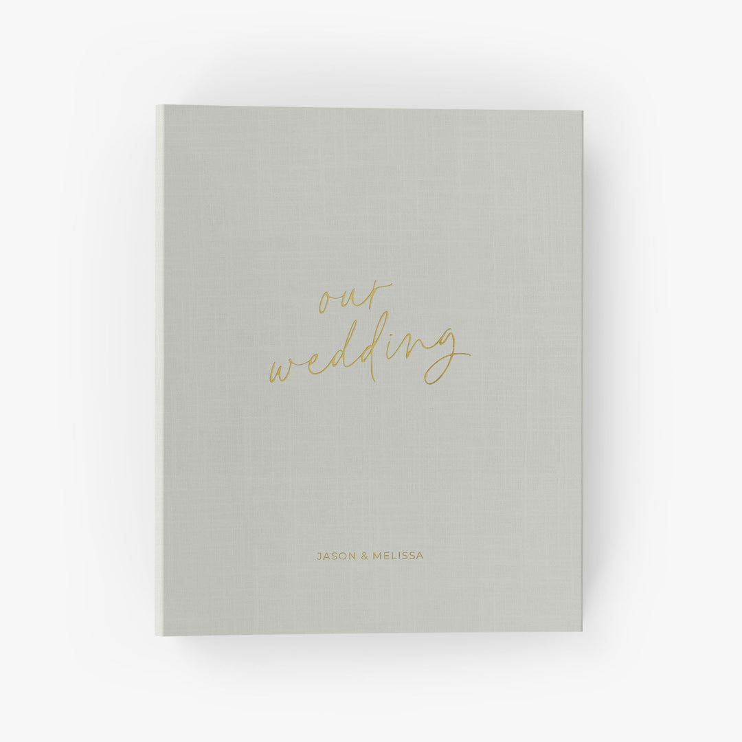 Our wedding binders are the perfect wedding planning tool, shown in a "our wedding" script design with the couple's first names