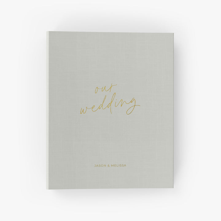 Our wedding binders are the perfect wedding planning tool, shown in a "our wedding" script design with the couple's first names