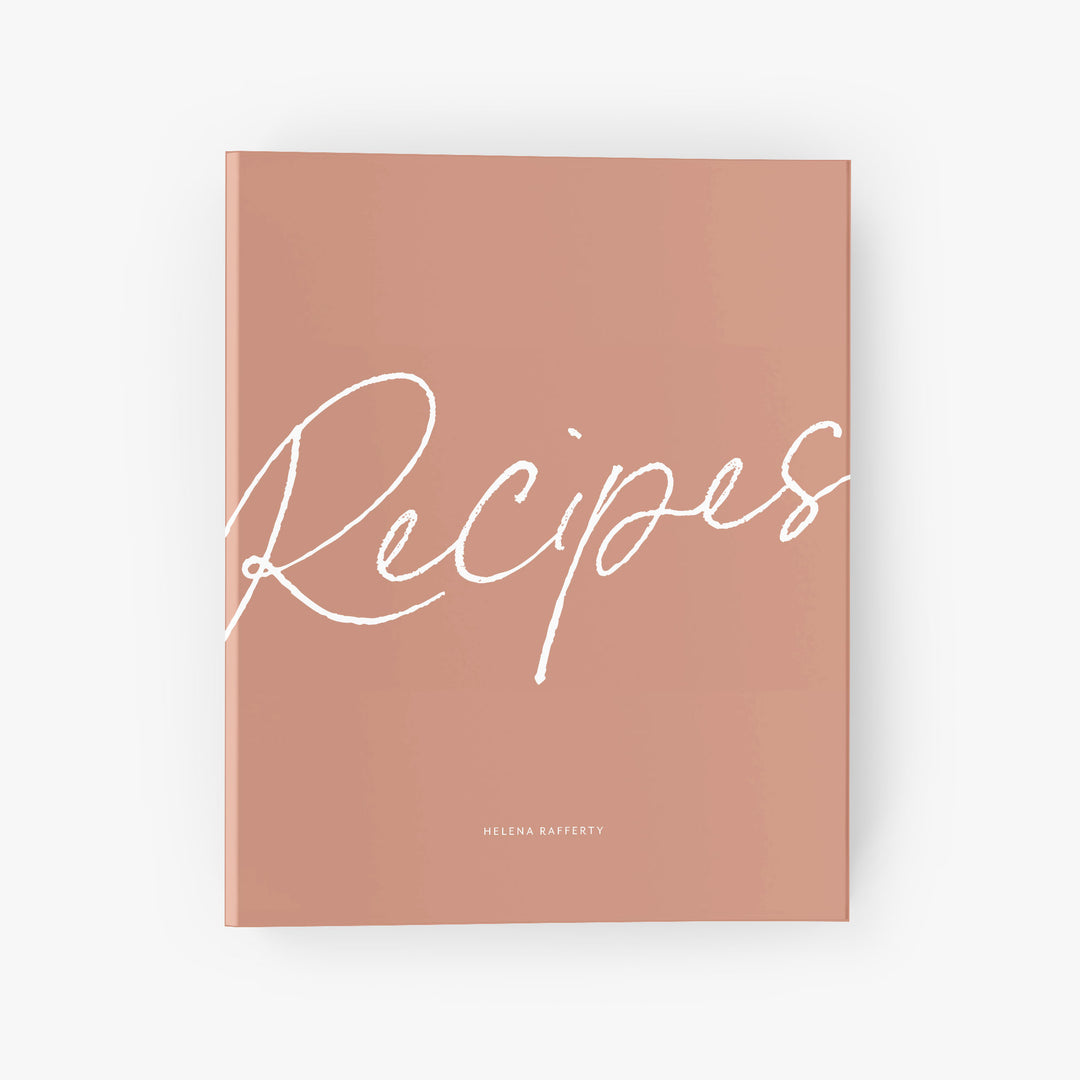 Custom recipe binder with bold calligraphy script says 'Recipes' on the cover above your personalization.