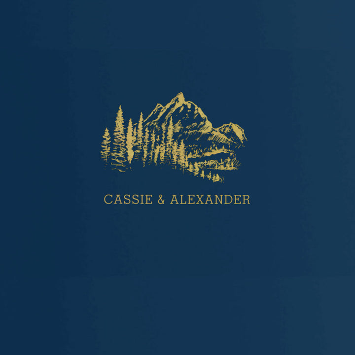 Our wedding binders are the perfect wedding planning tool, shown in a mountain treeline design with the couple's first names